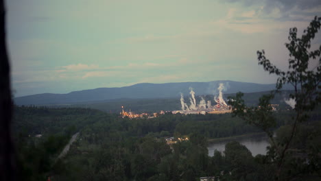 over of view sawmill and city from a forest hill