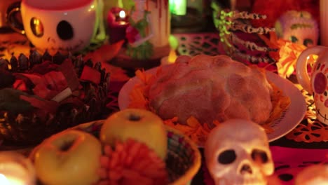 Offerings-on-the-altar,-Day-of-the-Dead-ofrendas,-panning