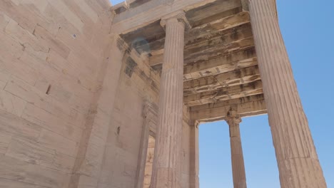 tilt down from scenic pandroseion entrance columns, historical site at acropolis of athens, greece