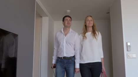 young couple moving in new flat