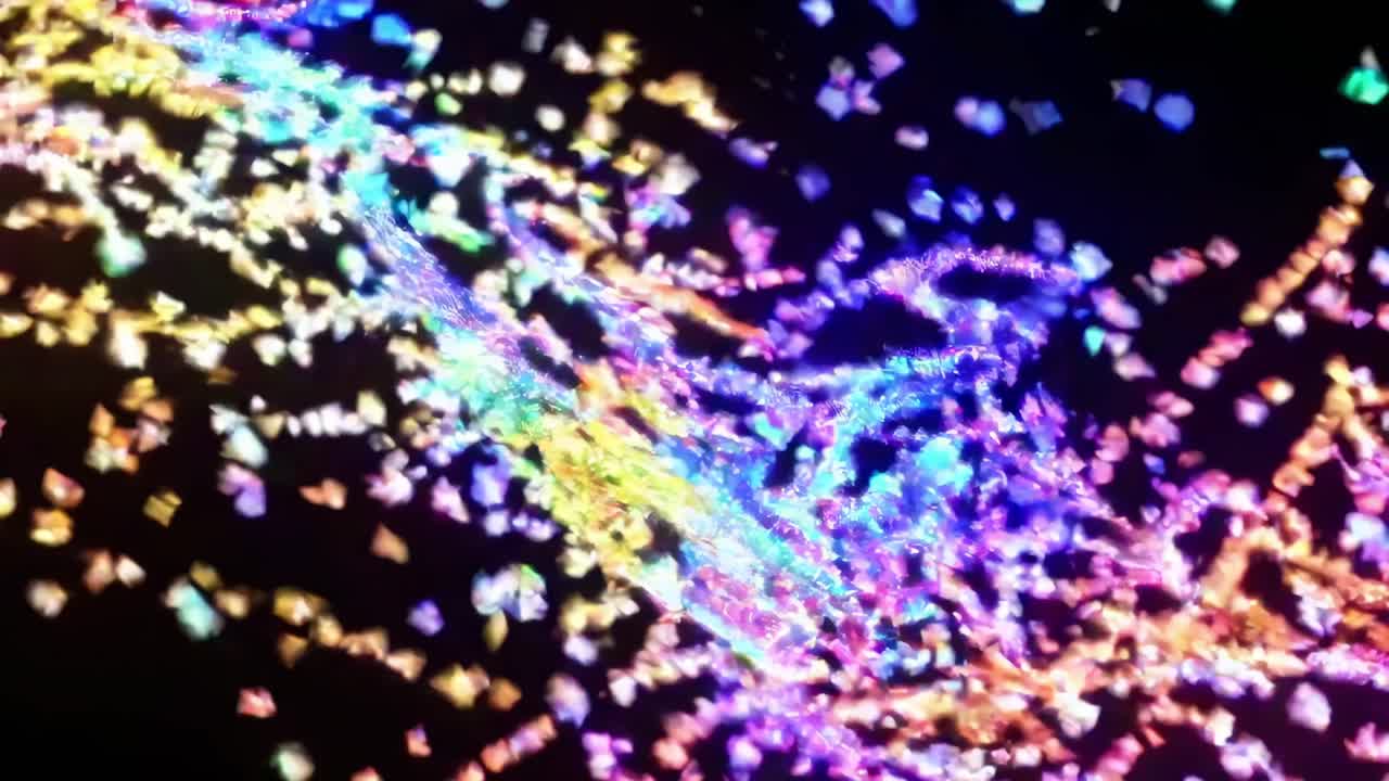 Glittering particles dancing and spiraling, generating mesmerizing wave movements across dark backdrop with vibrant, iridescent color dynamics and fluid energy