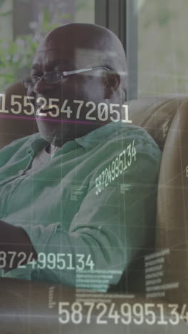animation of data processing over happy african american man using smartphone