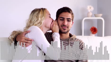 whispering to man, woman with arm around him, sound wave animation over them