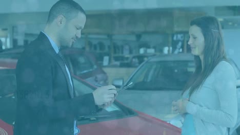 Animation-of-dots-falling-over-caucasian-male-car-dealer-and-female-customer