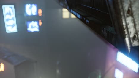 neon-lights-in-soft-focus-on-street-with-fog-at-night