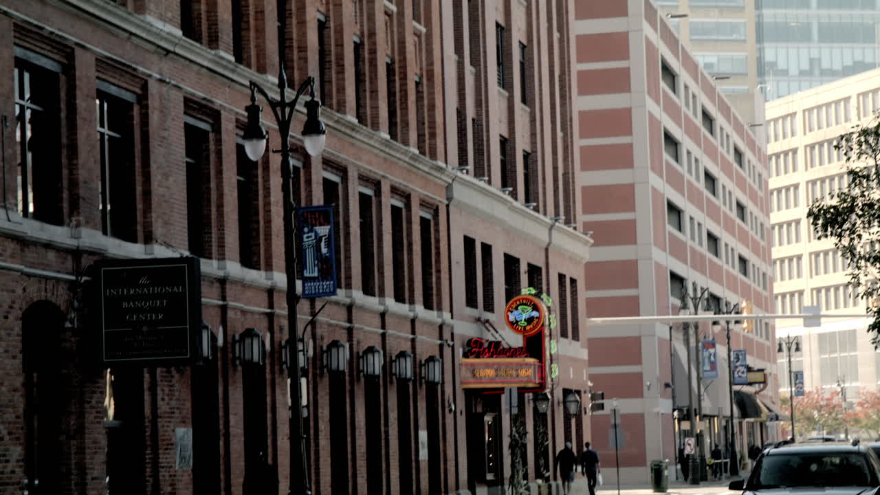Greektown Historic District street banner in Detroit, Michigan with video tilting down to the street.