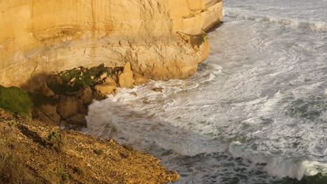 waves hitting cliffs at great ocean road