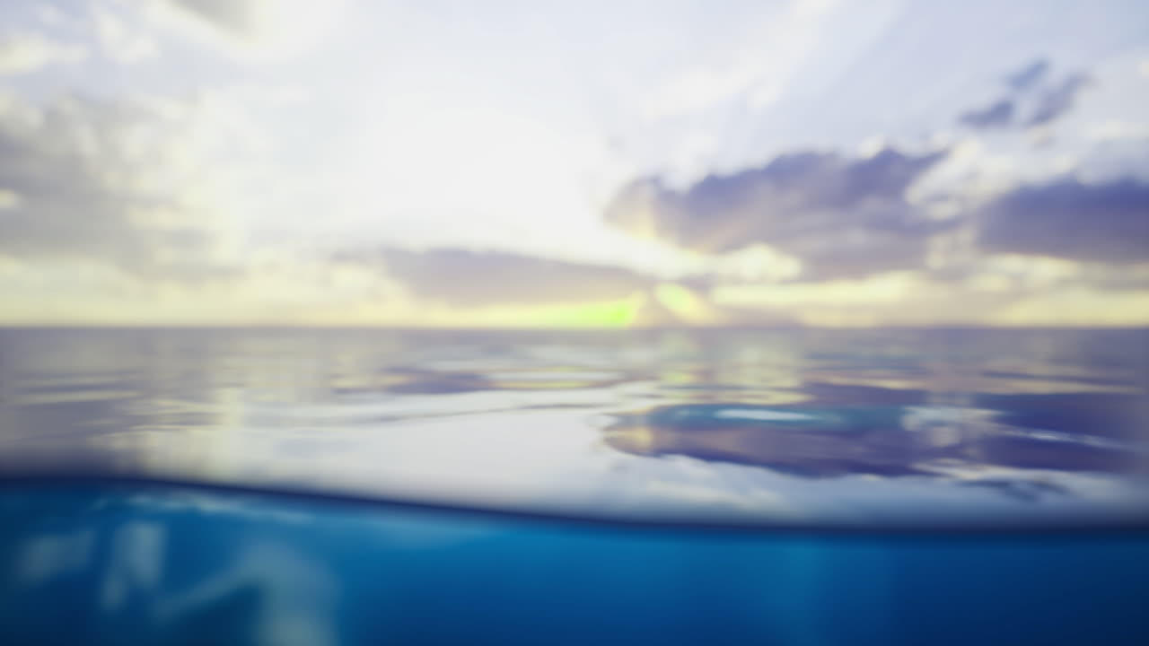 Serene ocean view with soft waves and gentle clouds at sunset