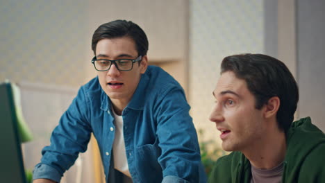 creative businessmen discussing project at office closeup. guys staring computer