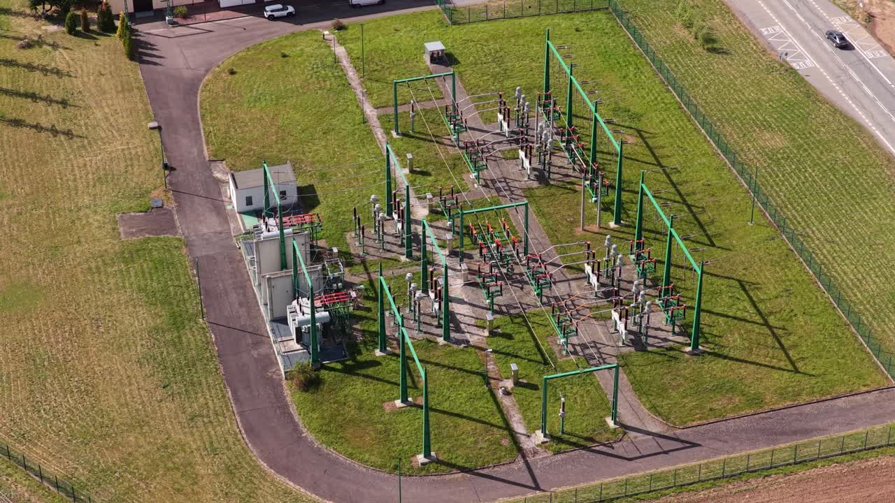 An electrical substation transforms energy and transfers it between cities. The construction of a complex network is advanced technology. Drone view