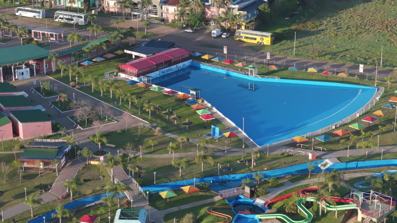 Aerial View of a Water Park with Slides and a Large Pool
