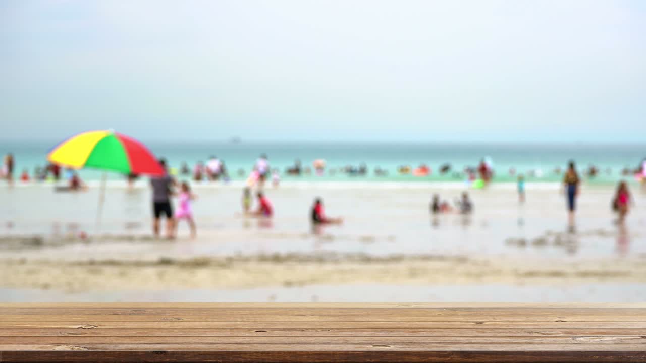 Wood shelf table with blurred sea beach on clouds blue sky background. product display template design