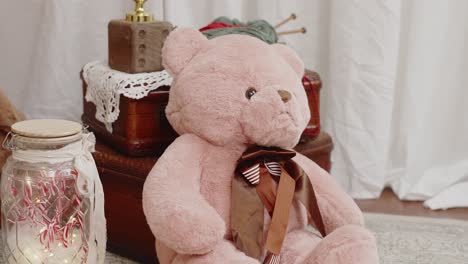 pink teddy bear with festive candy canes