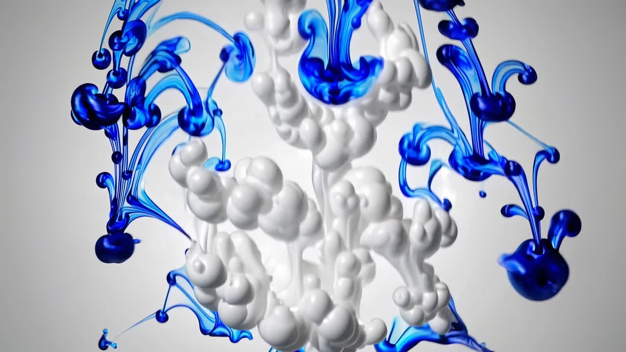 A mesmerizing video of blue and white ink swirling in water, captured from a top-down angle