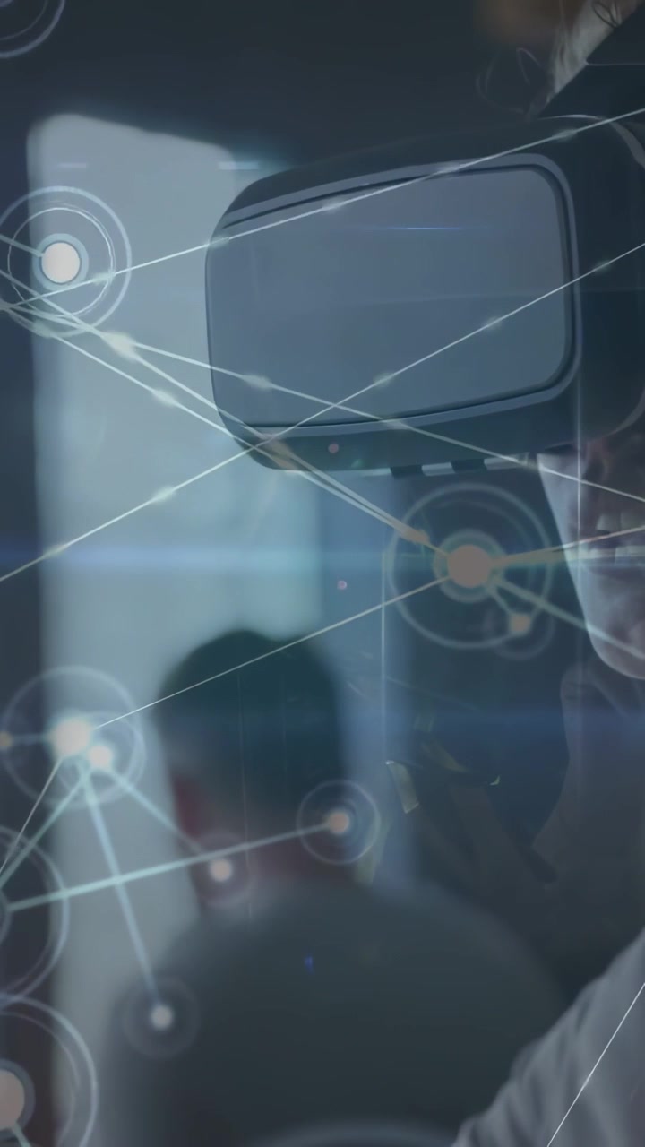 Vertical video: Woman in VR viewing hologram network appearing and converging on her for tech demo