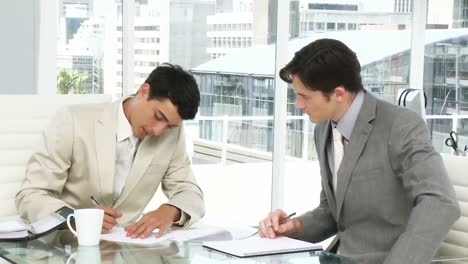 Two-male-executives-having-a-meeting