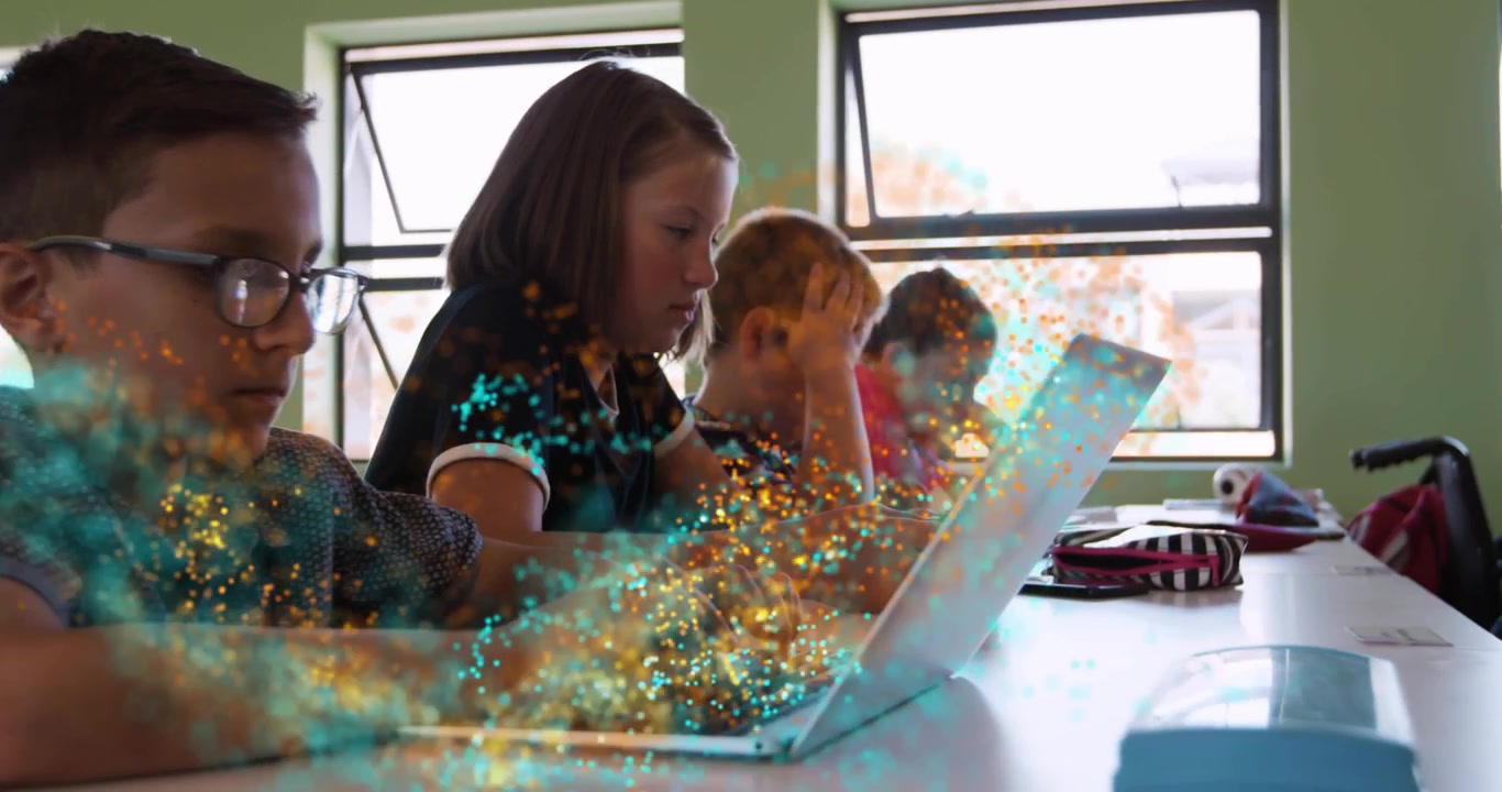 Kids typing at desk, leftmost tapping sweeping teal gold dust across laptops and hands for learning