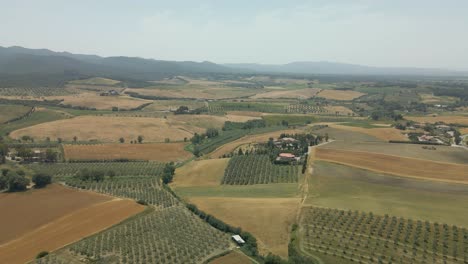 aerial images of tuscany in italy cultivated fields summer, aerial video over amazing tuscany landscape, with winding road with cypresses