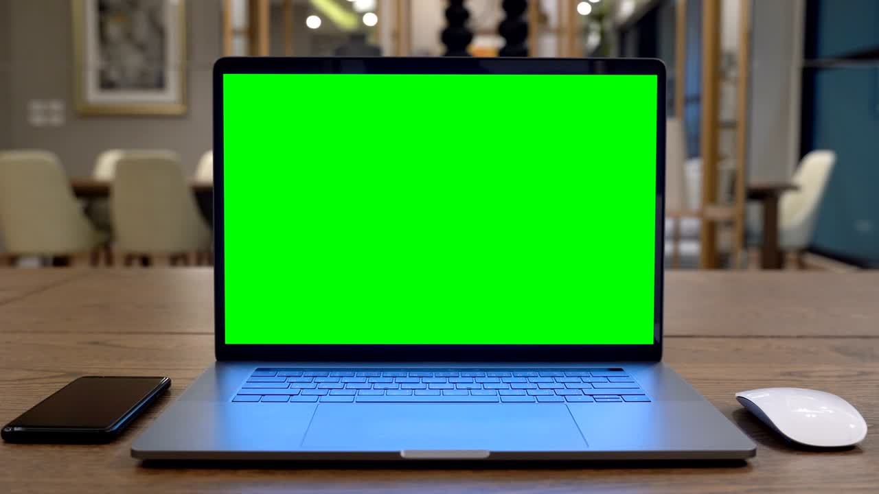 Computer laptop with green screen.