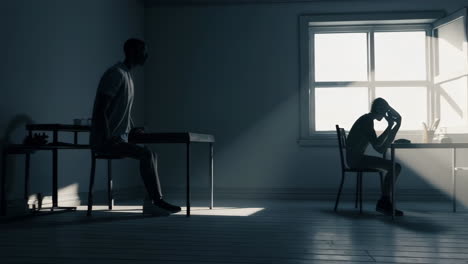 silhouettes of people in an interior room