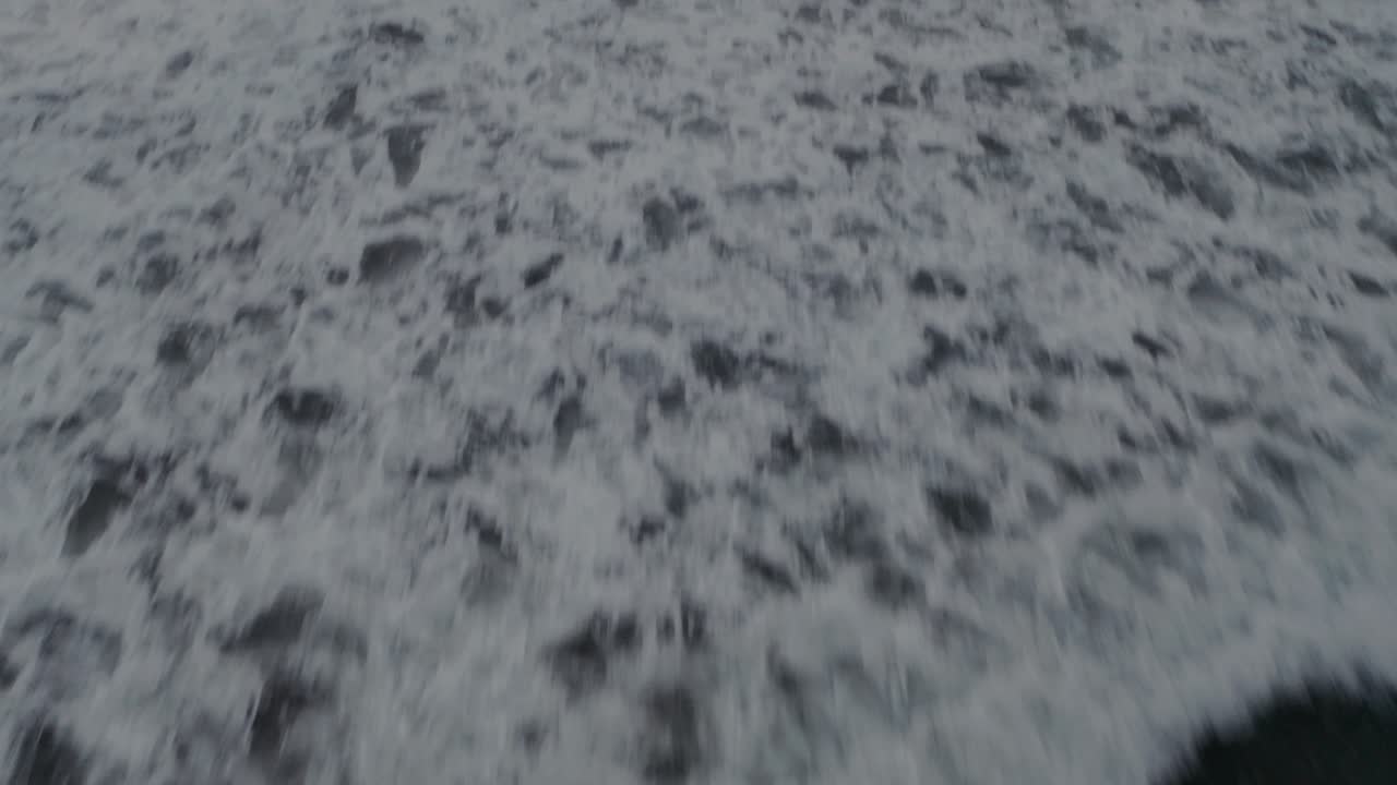 Aerial drone shot camera movement from top view to the sunset and a man kayaking in Costa Rica, 4k