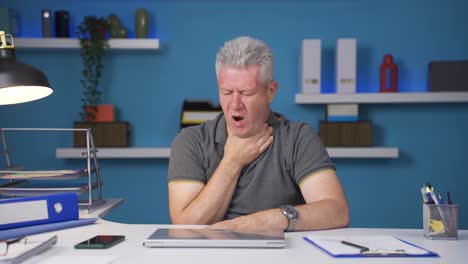 home office worker man suffering from sore throat.