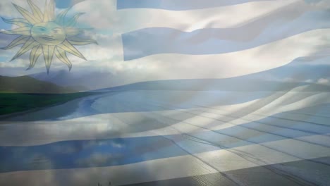 Animation-of-flag-of-uruguay-blowing-over-beach-landscape