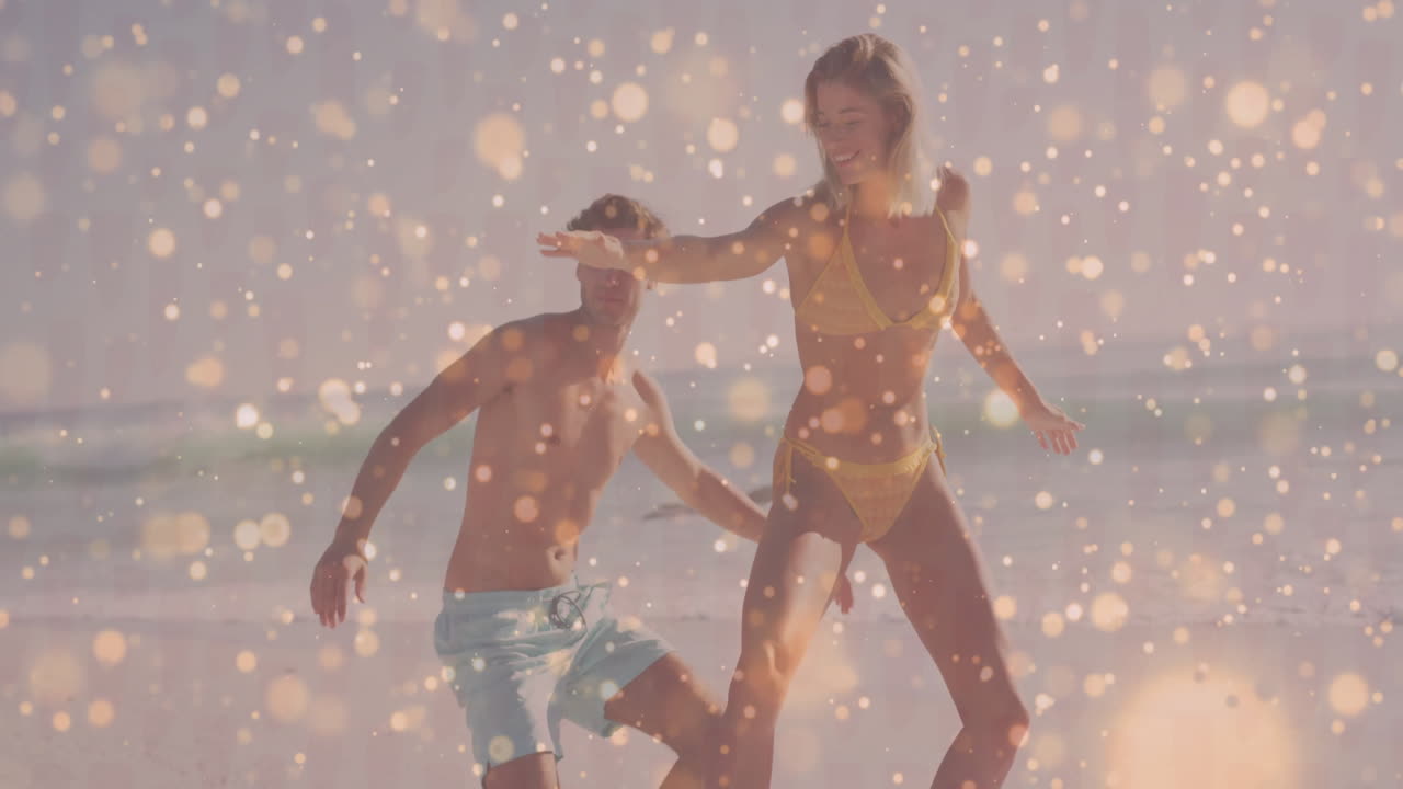 woman balancing on one leg while man supporting her in ocean, featuring animated health chart
