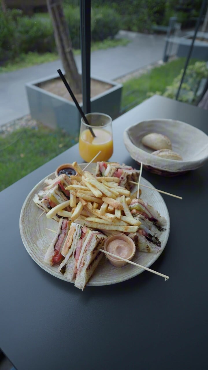 Plate of Club Sandwiches and French Fries with Orange Juice
