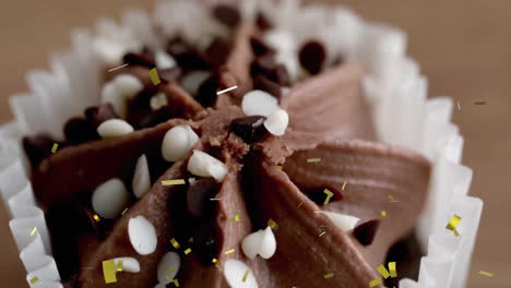 chocolate cupcake with sprinkles and animated confetti