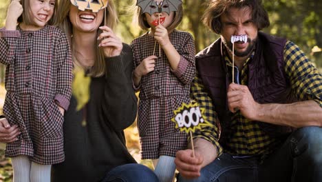 Tilt-up-video-shows-of-family-in-Halloween-masks