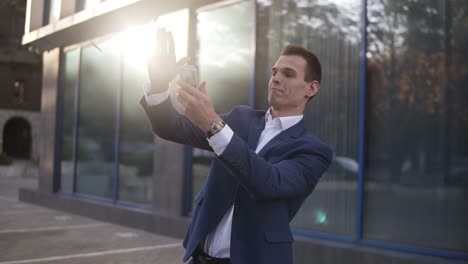 rich caucasian businessman throw handful of banknotes in the air. excited businessmen throw cash in front of office building and