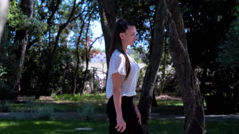slow motion shot of a young woman playing bowls in the garden of a villa