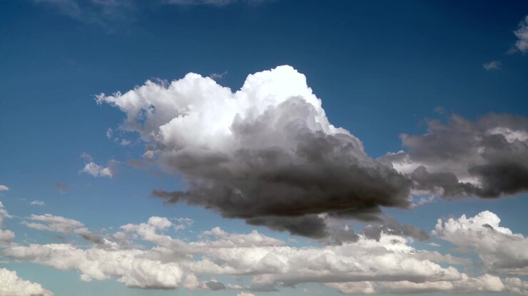 Large White Cumulus Cloud Drifting Across a Clear Blue Sky