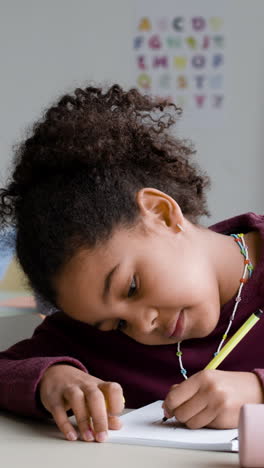 young girl concentrating on homework