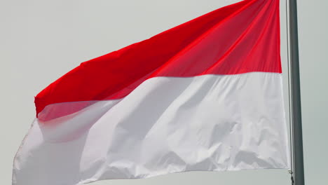 Close-up-Of-The-Waving-National-Flag-Of-Monaco-At-Daytime