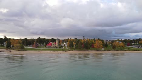 old mackinac point lighthouse, aerial fly forward view