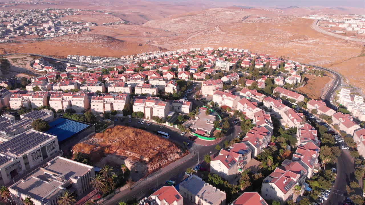 Aerial footage over Small town with red Rooftops in the desert