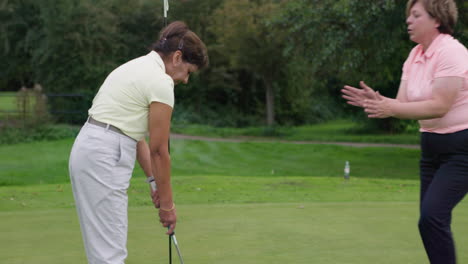 golfers on the green