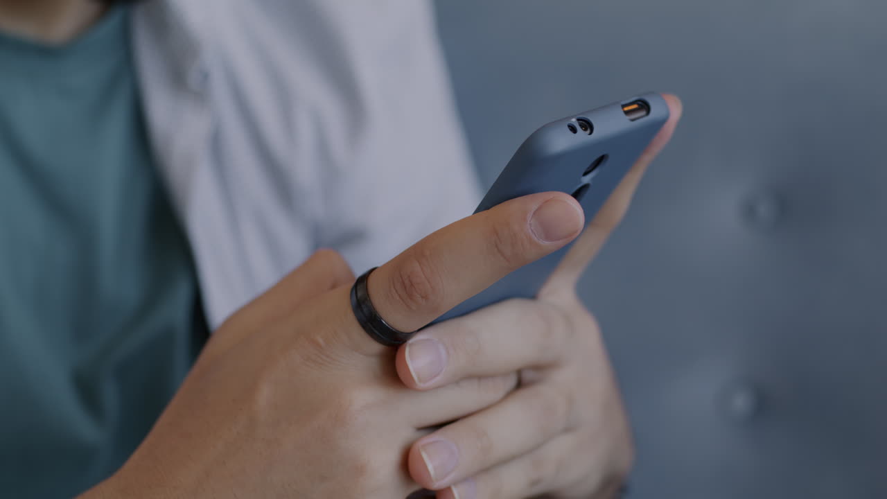 Person holding a gray smartphone