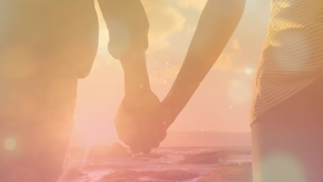 couple walks on beach with hypnotic lights in a calming animation.