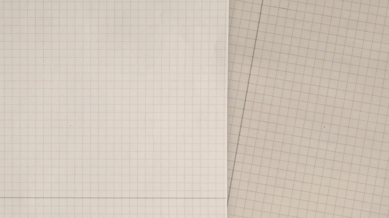 Overhead View of White and Beige Graph Paper with Grid Lines