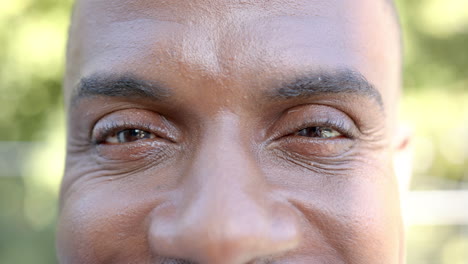 smiling man with close-up of face and eyes, showing happiness