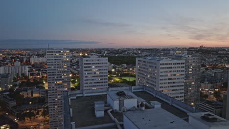 A-fast-paced-drone-shot-weaving-through-skyscrapers,-capturing-the-district's