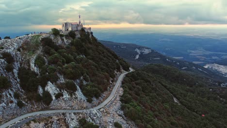 Drone-Shot-Sanctuary-of-Mare-de-Deu-del-Mont-Mountain-Range-and-Road-in-Catalonia-in-Spain