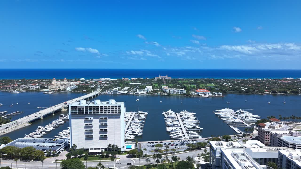 Push in drone shot of West Palm Beach marina, harbor and Atlantic Ocean during the day in Florida, USA