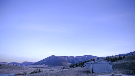 Starlapse-Day-to-Night-with-the-Milky-Way-and-Old-Sheds-in-the-Mountains