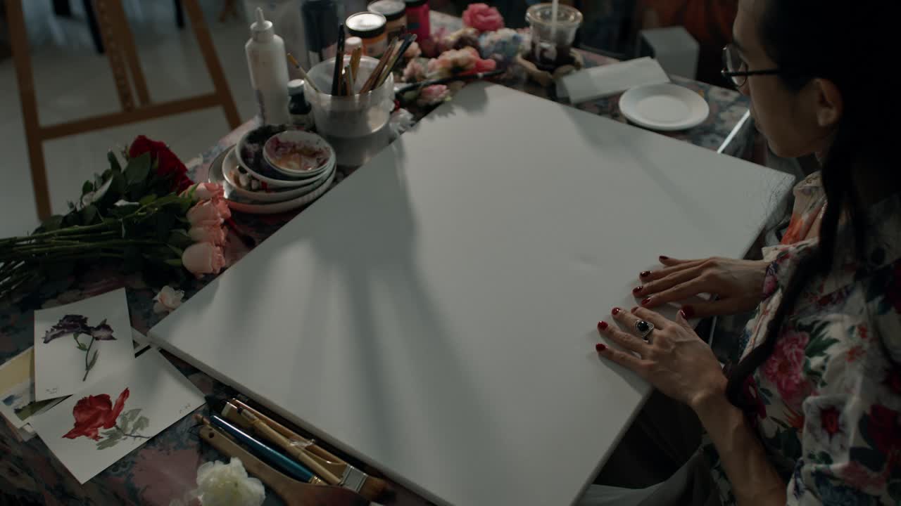 Artist at Work Painting Floral Artwork