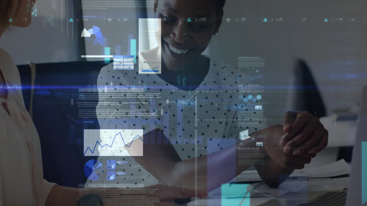 Two women analyzing business data on laptop papers, camera focusing hands causing charts overlaying