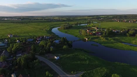 aerial view of a rural village by a river